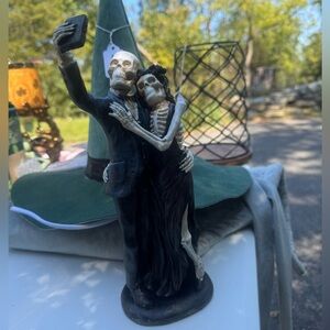 skeleton couple taking selfie halloween decor